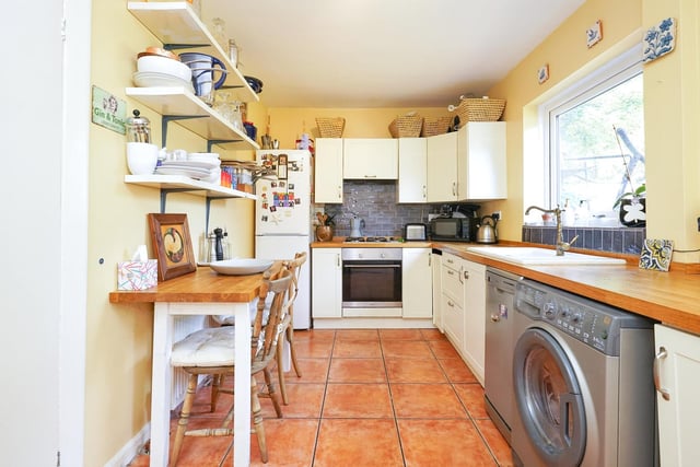 There is also a modern fitted kitchen with two large storage cupboards.