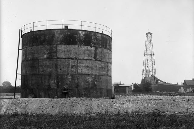 Storage tank and derrick at  oil wells in Tibshelf in June 1919: