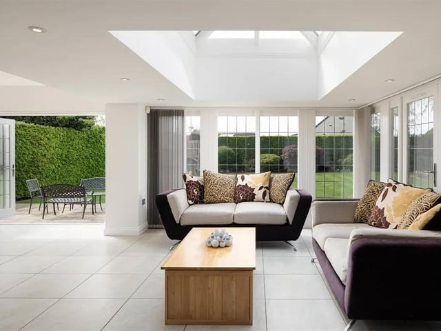 A lantern ceiling allows lots of natural light and the room leads out onto the south facing garden via bi-fold doors