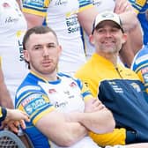 Rohan Smith, seated between Cameron Smith, left and Ash Handley, was all smiles at Leeds Rhinos' pre-season photocall in January. Picture by Allan McKenzie/SWpix.com.