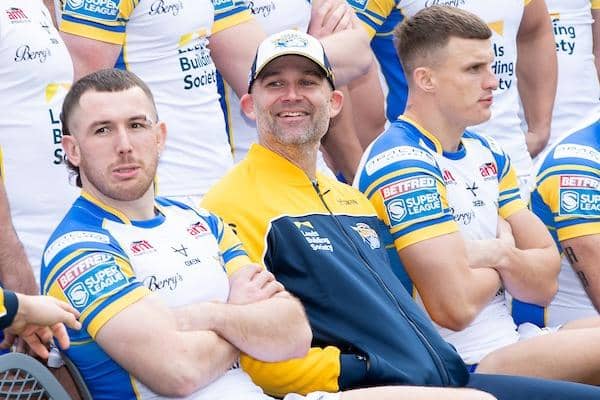 Rohan Smith, seated between Cameron Smith, left and Ash Handley, was all smiles at Leeds Rhinos' pre-season photocall in January. Picture by Allan McKenzie/SWpix.com.