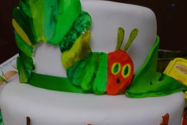 Kaylee Lennon said: "Very hungry caterpillar cake for my daughters first birthday (I painted the caterpillar and food)."