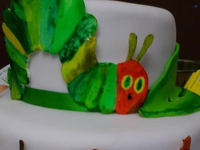 Kaylee Lennon said: "Very hungry caterpillar cake for my daughters first birthday (I painted the caterpillar and food)."