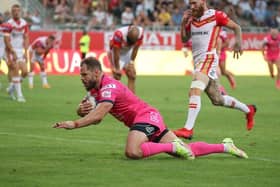 Aidan Sezer, pictured scoring Rhinos' match-winning extra-time try at Catalans in July, admitted he was gutted to miss the Grand Final. Picture by Manuel Blondeau/SWpix.com.