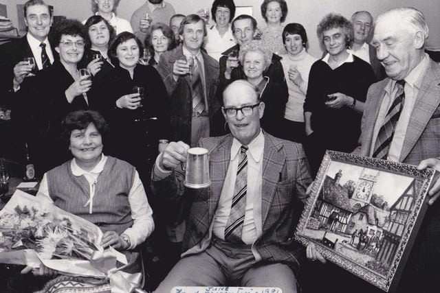 Staff at Dewsbury's new swimming baths in 1981. They are raising a glass to one of their colleagues, Bill, the man seated, who was retiring.