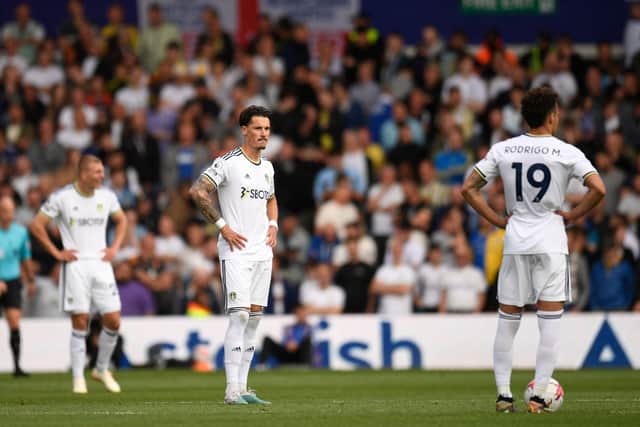 DROP CONFIRMED: Leeds United trio Rasmus Kristensen, Robin Koch and Rodrigo after Tottenham's third goal. Photo by OLI SCARFF/AFP via Getty Images.