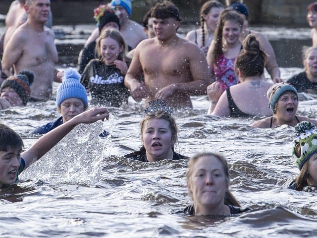 Hardy swimmers brave high water levels, a strong current and a water temperature of 6 degrees by taking part in the annual New Years Day Joe Town - Lilian Rickett Memorial Swim in the River Wharfe at Otley. Picture Tony Johnson