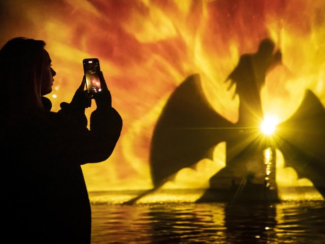 Mystical creatures float over the lake, as if by magic.