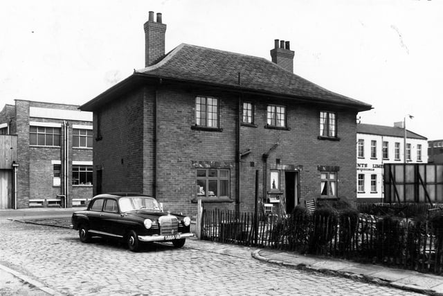 This view dating March 1965 from looks from Blackburn Street onto the back entrance and garden of 95 Whitehall Road. This property also had an entrance to the side which led to Dr J.E. Rusby's surgery.