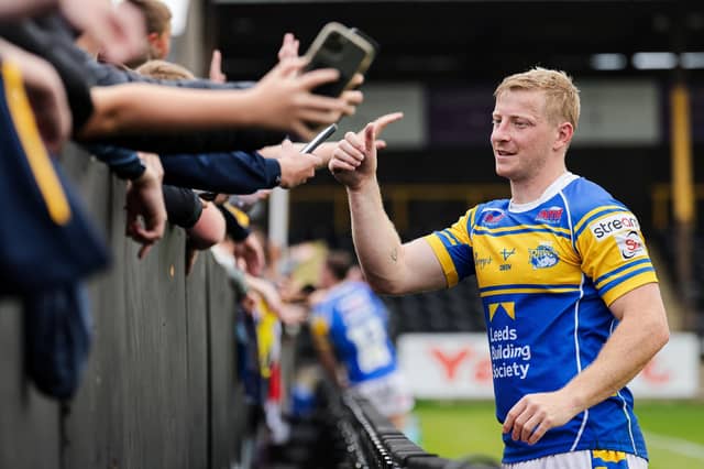 Lachie Miller celebrates with travelling fans after Leeds Rhinos' win at Castleford Tigers in May, but coach Brad Arthur is expecting a tough game there on Saturday. Picture by Alex Whitehead/SWpix.com.