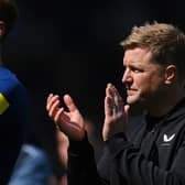 LEEDS, ENGLAND - MAY 13: Dan Burn and Eddie Howe, Manager of Newcastle United, applaud the fans after the draw during the Premier League match between Leeds United and Newcastle United at Elland Road on May 13, 2023 in Leeds, England. (Photo by Stu Forster/Getty Images)