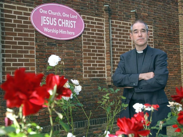 The Reverend Neil Bishop outside St Andrew's Methodist Church in October 2003.
