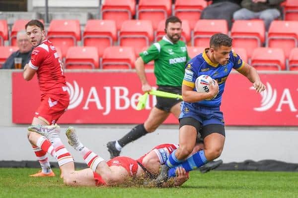 Corey Hall is tackled by Brodie Croft during Trinty's defeat at Salford. Picture by Olly Hassell/SWpix.com.