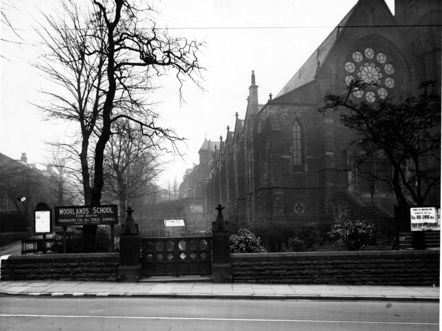Headingley Hill congregational church on Headingley Lane next to Moorland Boys School. Wooden gates by ornate stone gateposts are in the centre of the picture. The church has a large, intricate, arched window. Pictured in March 1945.