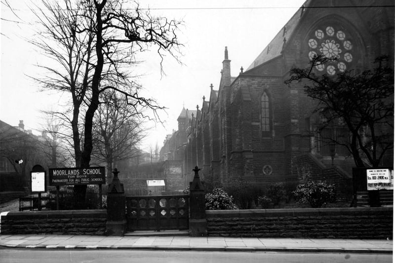Headingley Hill congregational church on Headingley Lane next to Moorland Boys School. Wooden gates by ornate stone gateposts are in the centre of the picture. The church has a large, intricate, arched window. Pictured in March 1945.