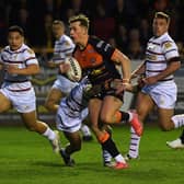 Tigers Jack Broadbent is tackled by Trinity's Will Dagger, but the break led to Castleford's opening try. Picture by Jonathan Gawthorpe.
