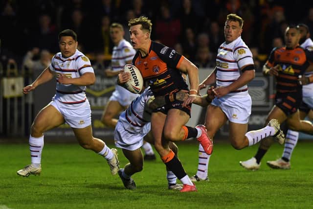 Tigers Jack Broadbent is tackled by Trinity's Will Dagger, but the break led to Castleford's opening try. Picture by Jonathan Gawthorpe.