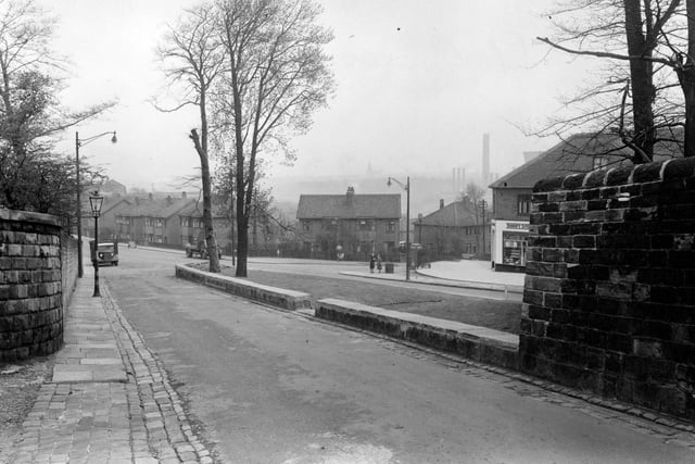 St. Ann's Lane looking towards the junction with Kirkstall Hill and Burley Road, with Burley Wood Lane going off to the right in May 1951. Thrift Stores Ltd., grocers, is just visible on the corner, partially hidden by a stone wall.