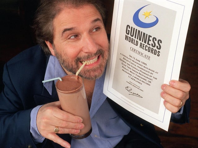 George Psarias, owner of the Olive Tree Greek Restaurant in Rodley, is pictured with his Guinness World Records certificate for a giant milk shake.