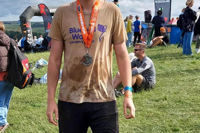 100081 – Tom Hill after finishing the Tough Mudder challenge