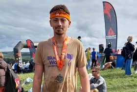 100081 – Tom Hill after finishing the Tough Mudder challenge