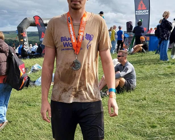 100081 – Tom Hill after finishing the Tough Mudder challenge