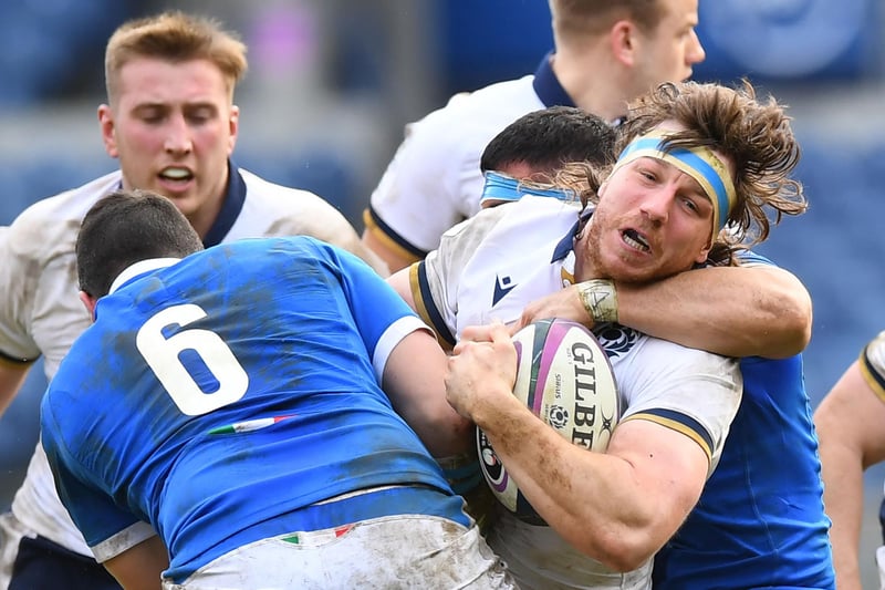 Scotland flanker Hamish Watson gets tackled during the Six Nations international rugby union match between Scotland and Italy at Murrayfield Stadium in Edinburgh on March 20, 2021 (Photo by Andy Buchanan/AFP via Getty Images)