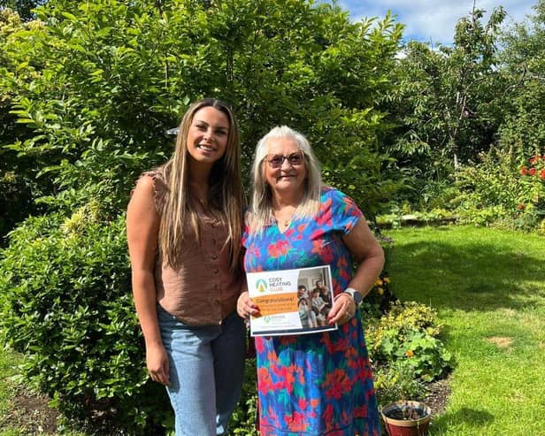 Craggs Energy’s Cosy Heating Club Winner, Gwen Commons, with her prize certificate.