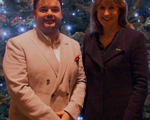 Lloyd Griffith and Rachel Reeves MP at the NSPCC's Carols by Candlelight service.
