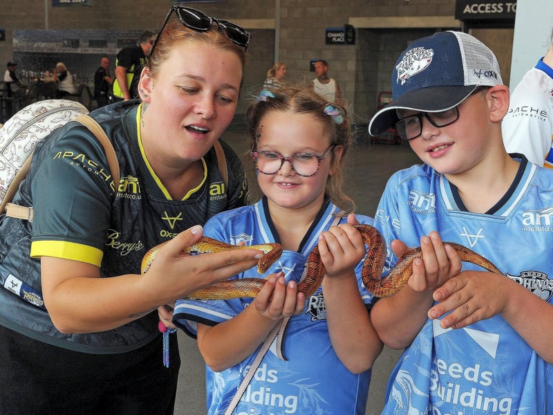 Rhinos fans Rebecca McDermott, Daisy-Mae, aged eight and Charlie, 11, of Bradford. meet a snake from Captivating Creatures in the South Stand.