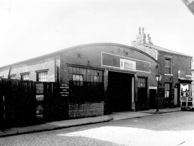 The Leeds Coca Cola Depot on Buslingthorpe Lane pictured in September 1958. Notice states, 'Coca Cola Northern Bottler's Limited Petroleum Spirit Depot'. In 1886 Dr. John Styth Pemberton devised a recipe for a syrup drink, mixed with soda water it immediately became a popular soda-fountain drink. The first sales of Coca Cola in Britain began in 1901.