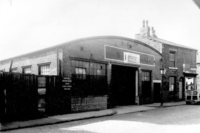 The Leeds Coca Cola Depot on Buslingthorpe Lane pictured in September 1958. Notice states, 'Coca Cola Northern Bottler's Limited Petroleum Spirit Depot'. In 1886 Dr. John Styth Pemberton devised a recipe for a syrup drink, mixed with soda water it immediately became a popular soda-fountain drink. The first sales of Coca Cola in Britain began in 1901.