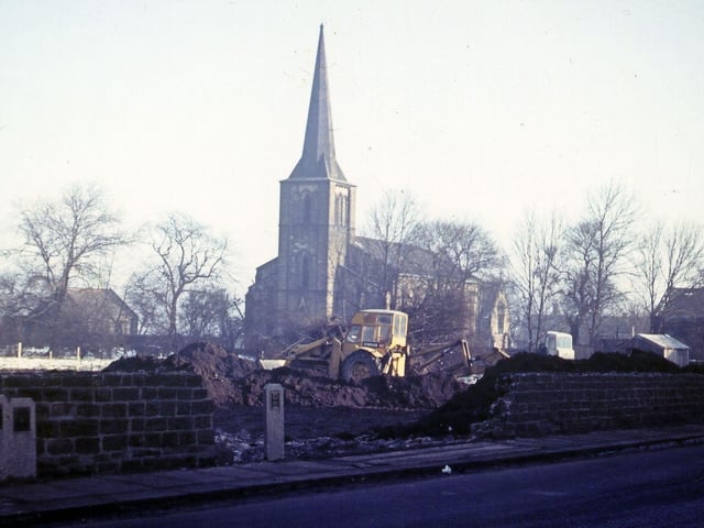 Victoria Road showing the beginnings of the construction of a new garage site. St. Peter's Church is seen in the background. Pictured in March 1962.