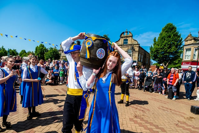 Ossett Beercart festival 2023 starts with the Beer Cart Procession though the streets of Ossett, then the beer dance by Wakefield Morris dancers to celebrate the carrying of the first barrel into the Town Hall followed by dancing around the town centre by Morris Dancing from around the area Picture By Yorkshire Post Photographer,  James Hardisty. Date: 3rd June 2023.