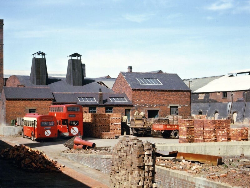 George Armitage & Sons Ltd. Brick Works showing brick kilns. Also seen is a red single decker bus and a red double decker bus, transport for workers at Woodkirk.
