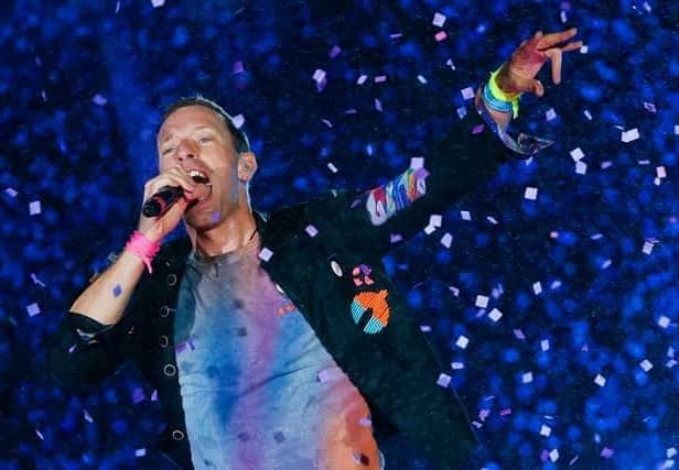 Chris Martin from Coldplay. The British rock band are set to headline Glastonbury Festival on Saturday night, but will the weather hold out for fans attending the festival? (Credit: Getty Images)