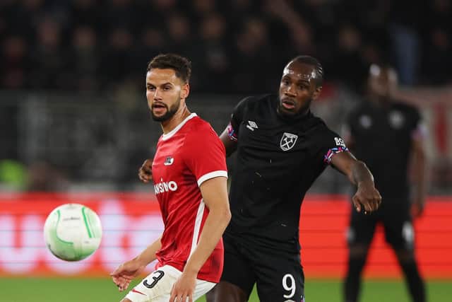 ALKMAAR, NETHERLANDS - MAY 18: Pantelis Chatzidiakos of AZ Alkmaar passes the ball whilst under pressure from Michail Antonio of West Ham United during the UEFA Europa Conference League semi-final second leg match between AZ Alkmaar and West Ham United at AFAS Stadion on May 18, 2023 in Alkmaar, Netherlands. (Photo by Dean Mouhtaropoulos/Getty Images)