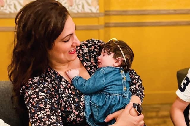 Vicki with her youngest child, two-year-old Florence.