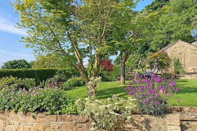 Lawned gardens have established trees, shrubs and flower beds.