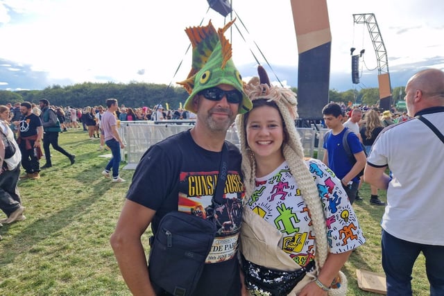 Adam Connor with his daughter Elise, who were spotting two of the best sets of headgear at this year's event.. Adam said: "It's been a superb festival. Very safe and all the better wearing a fish hat."