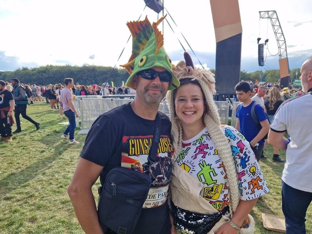 Adam Connor with his daughter Elise, who were spotting two of the best sets of headgear at this year's event.. Adam said: "It's been a superb festival. Very safe and all the better wearing a fish hat."