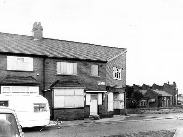 A boarded up premises on South End Grove in May 1979. On the left a caravan is parked while on the right can be seen the J & C.Croysdale Ltd building.