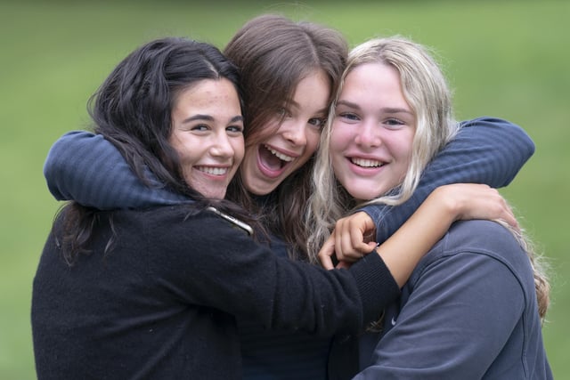 Pictured (left to right) Siena Edhem, Alexandra Hall and Grace Bond celebrate after receiving their GCSE results at The Grammar School in Leeds.