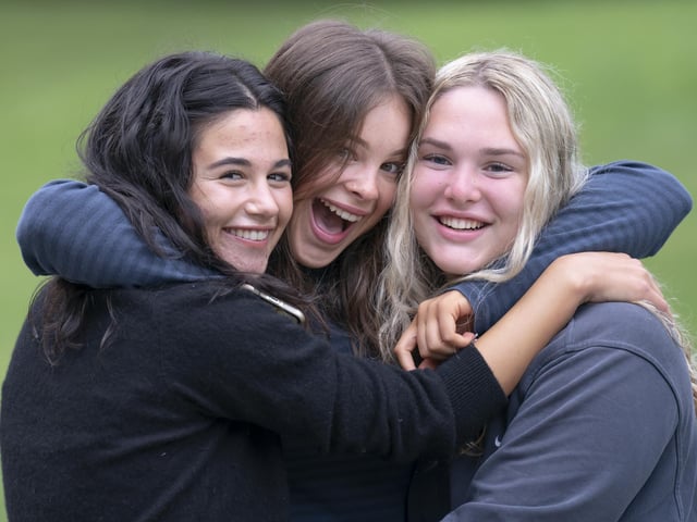 Pictured (left to right) Siena Edhem, Alexandra Hall and Grace Bond celebrate after receiving their GCSE results at The Grammar School in Leeds.