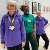 A group of dedicated volunteers pictured together, representing Leeds Hospitals Charity and the Leeds Teaching Hospitals NHS Trust, who play an important role in supporting patients and visitors.