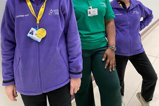 A group of dedicated volunteers pictured together, representing Leeds Hospitals Charity and the Leeds Teaching Hospitals NHS Trust, who play an important role in supporting patients and visitors.