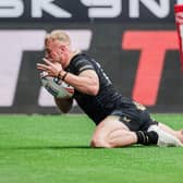 Castleford Tigers signing Jack Ashworth scores for Hull FC against Wigan Warriors in July. Picture by Alex Whitehead/SWpix.com.