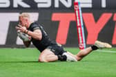 Castleford Tigers signing Jack Ashworth scores for Hull FC against Wigan Warriors in July. Picture by Alex Whitehead/SWpix.com.