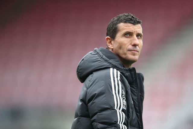Leeds United's Spanish head coach Javi Gracia checks out the conditions ahead of the English Premier League football match between Bournemouth and Leeds United at the Vitality Stadium in Bournemouth, southern England on April 30, 2023. (Photo by Steve Bardens / AFP) / RESTRICTED TO EDITORIAL USE. No use with unauthorized audio, video, data, fixture lists, club/league logos or 'live' services. Online in-match use limited to 120 images. An additional 40 images may be used in extra time. No video emulation. Social media in-match use limited to 120 images. An additional 40 images may be used in extra time. No use in betting publications, games or single club/league/player publications. /  (Photo by STEVE BARDENS/AFP via Getty Images)