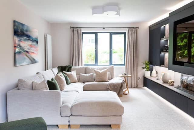 Charlotte created a feature feature media wall to break up a long room in her house Picture: Natasha Cadman Photography